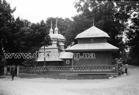 Wooden church of St. John the Theologian and belfry. View from east (Mykola Zharkikh's archive, negatives collection,  590-02. 19.08.1989)